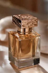 A premium studio product shot showing how a custom metal cap elevates the look of perfume packaging design.