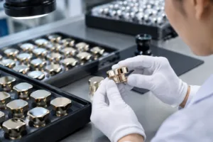 Close-up inspection scene for perfume bottle cap quality control on decorative metal caps